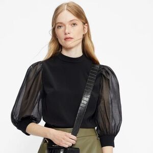 Women’s black top with puffy sleeves